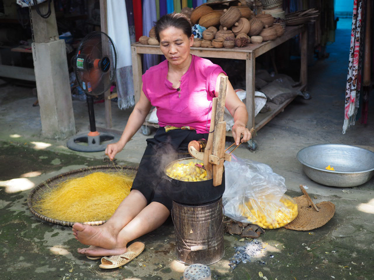 Workshop silk warm cocoons spinnig, traditional handicrafts in Mai Chau, Vietnam